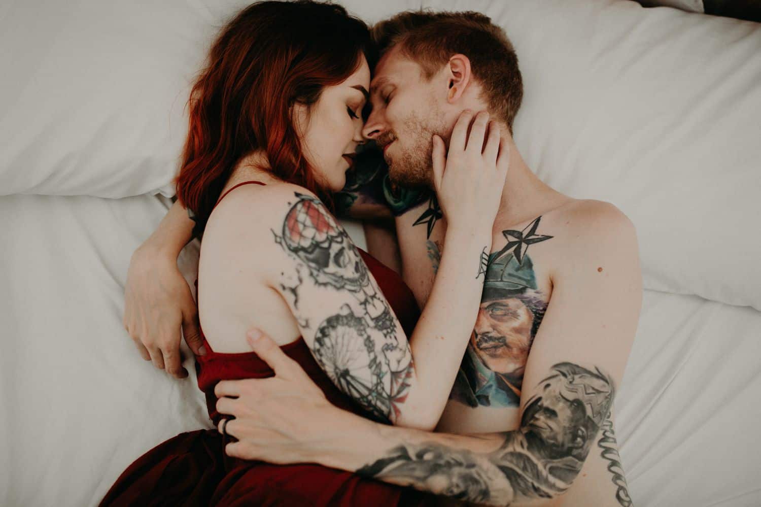 This Is the Boudoir Photography Shy Couples Need To See: Tattooed Couple Snuggles On Bed