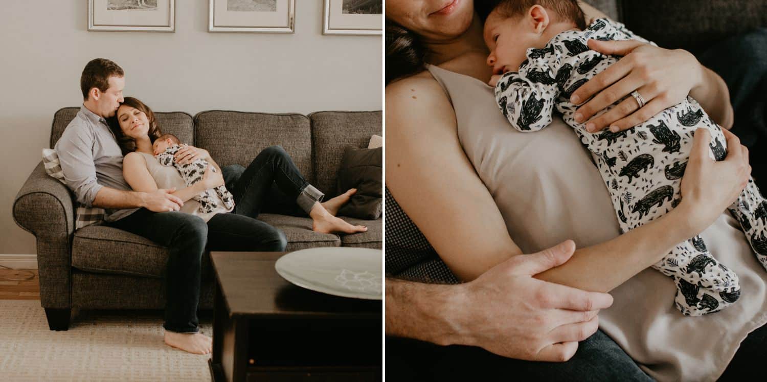 Lifestyle Newborn Photos: Left / Dad, Mom, and Baby snuggle close in a full-length photo of the family on their gray couch. Right / A close-up photo shows both parents' hands cradling their new infant in the baby's onesie.