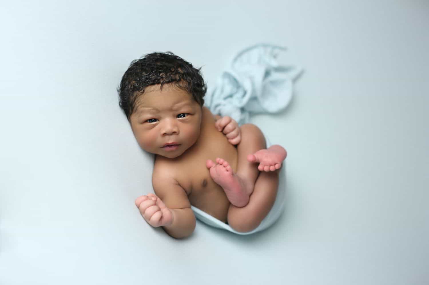 How To Attract New Clients In 3 Bold Business Moves: Baby boy on white backdrop by Cassie Clayshulte