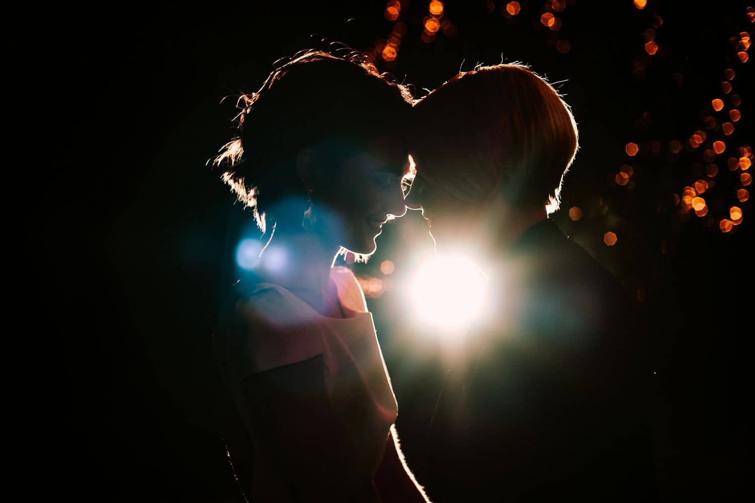 Wedding couple dancing in silhouette