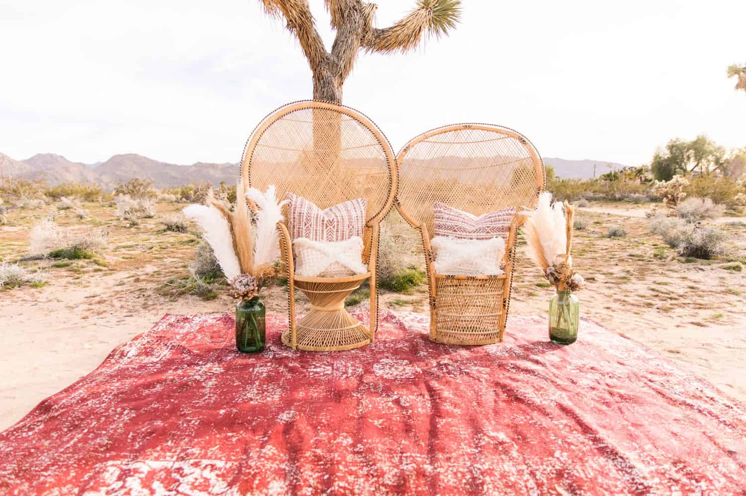 Tips for an Easy, Affordable Styled Shoot (high-back rattan chairs on a rug in the desert)