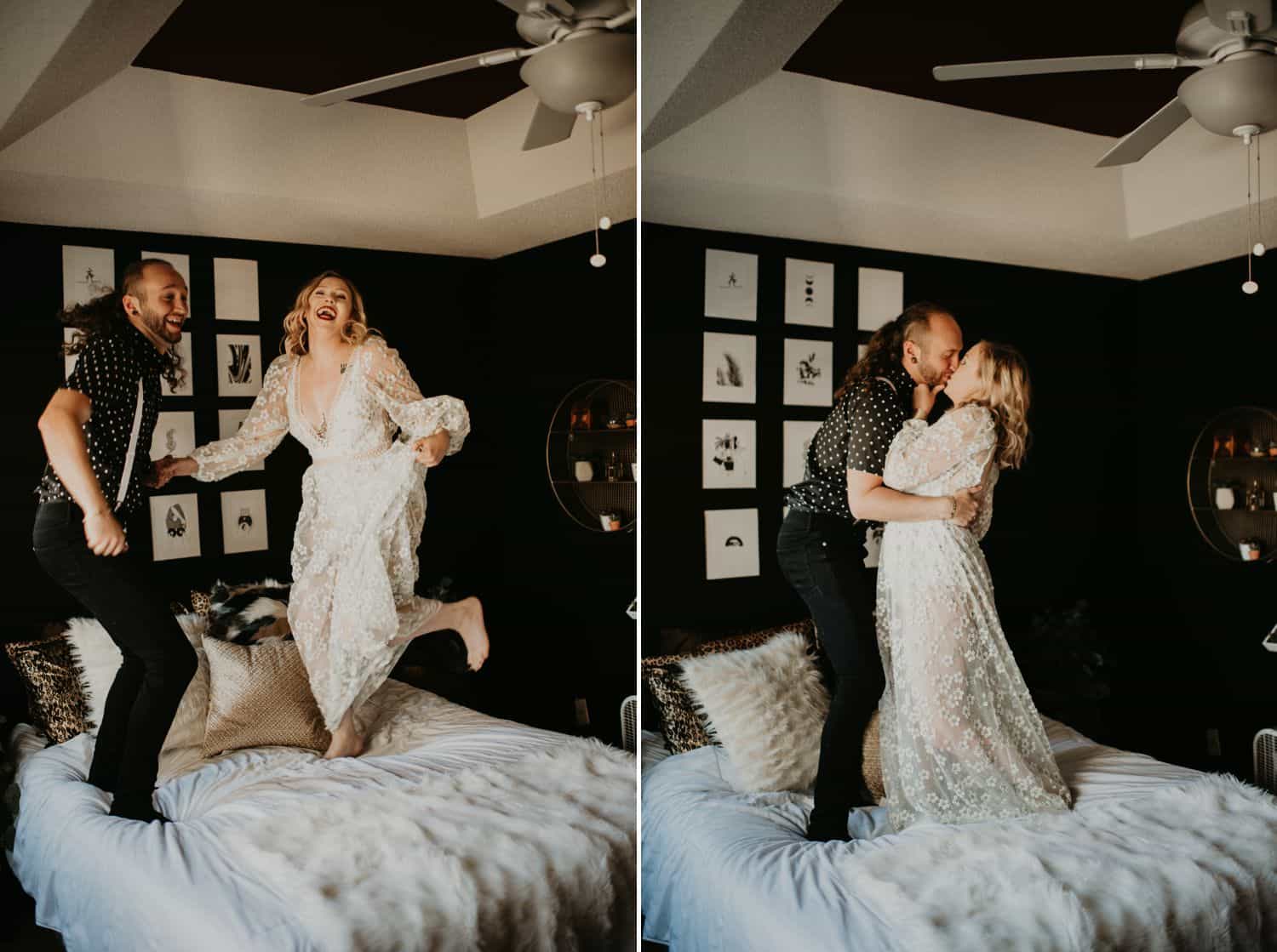 A couple jumps on their white-covered bed, laughing and kissing. The room is dim, with low light. Photographs are by Shelby Laine Photography.