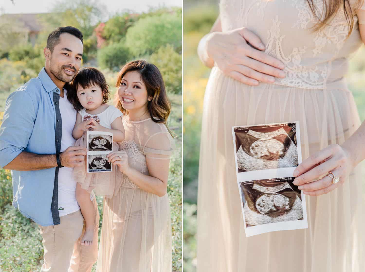 Two parents stand with their young daughter displaying two sonogram photographs