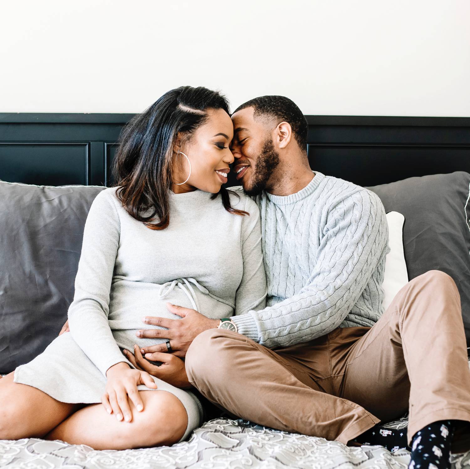 Sasha Q. Photography uses simple indoor poses when photographing expectant parents