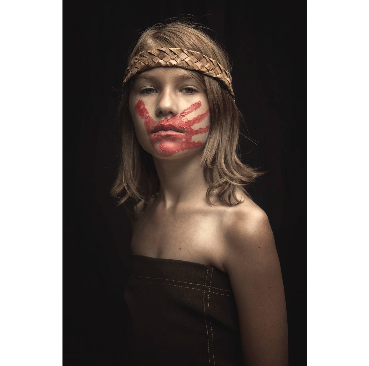 Nolan Streitberger photographs his daughter Haley, a member of the Cowlitz tribe, wearing the red handprint across her mouth that symbolizes the deaths of more than 500 Native women and girls.