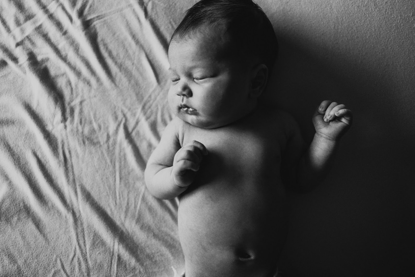 Black and white photo of a newborn baby