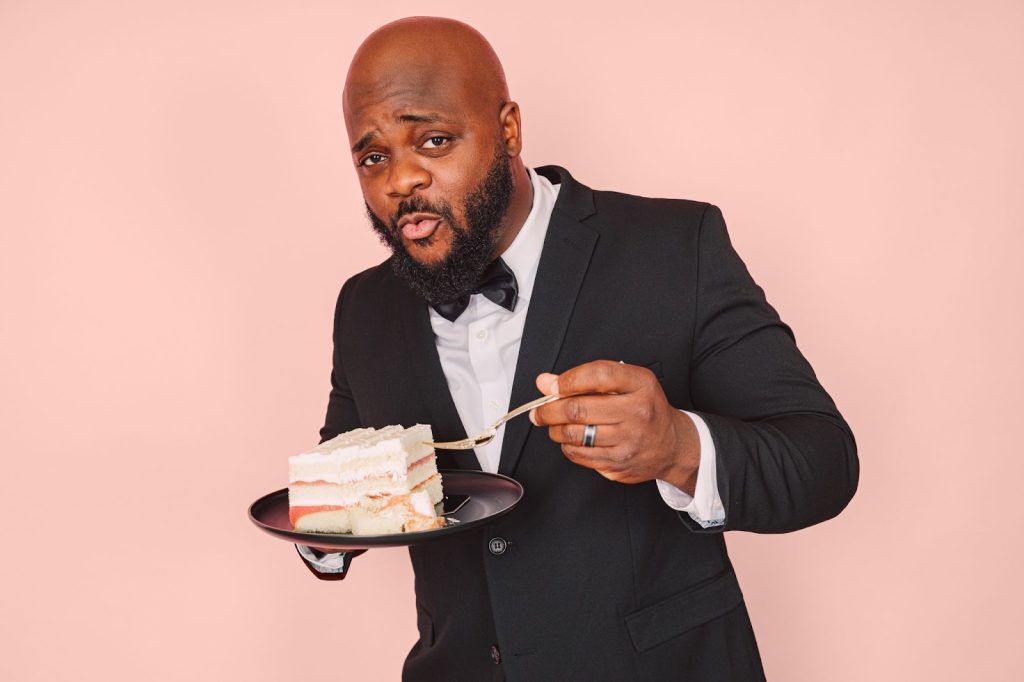 Personal branding photograph of man eating a cake