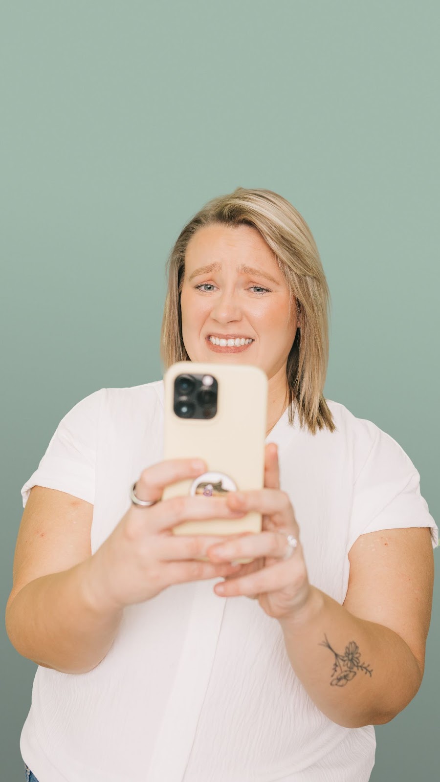 Girl taking selfie with an unsure expression