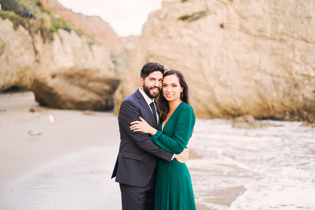 Engagement photo of couple on a beach