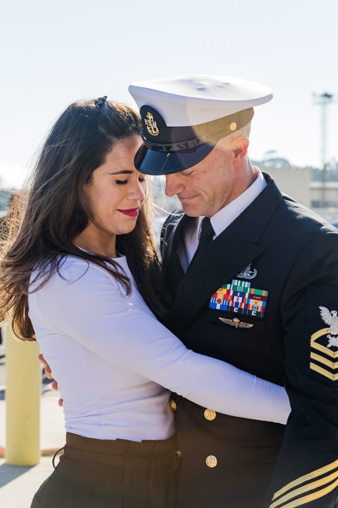 military couple hugging