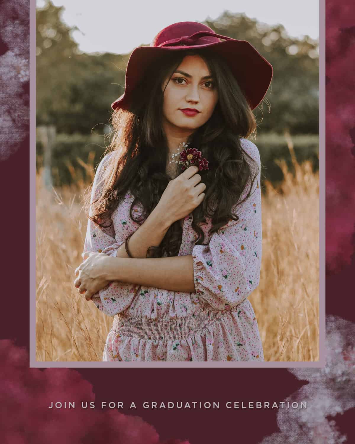 A stylized portrait of a young woman with long, wavy hair. She stands in a wheat-filled field wearing a lavender dress and a burgundy hat. She's holding tiny purple daisies in her hand.