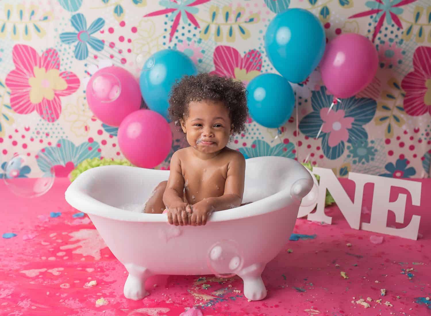 The best toddler photography props include this miniature claw-foot bathtub. Fill it with soap bubbles and set it up in a waterproof area, then let the splashing commence!