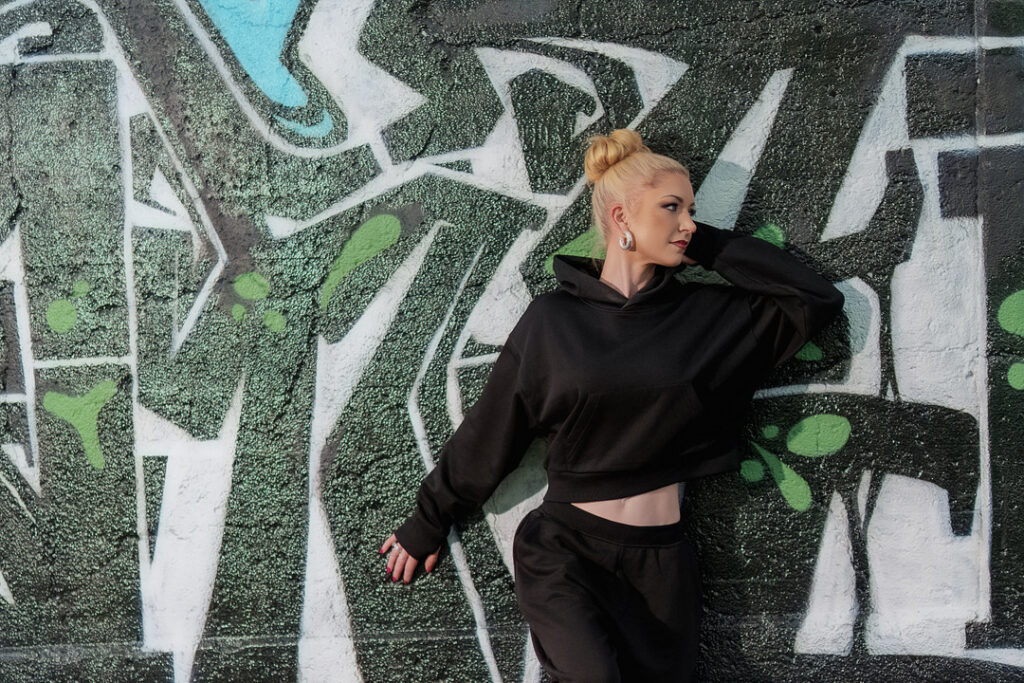 woman against a colorful wall
