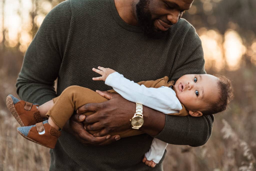man holding baby