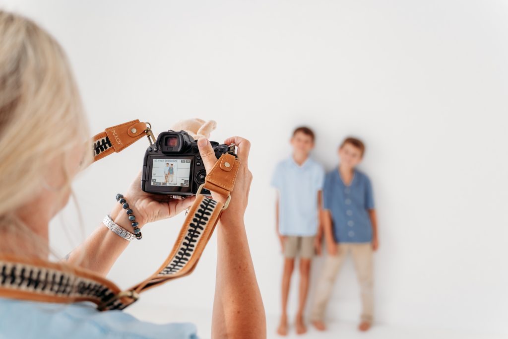 Photographer taking photos of family
