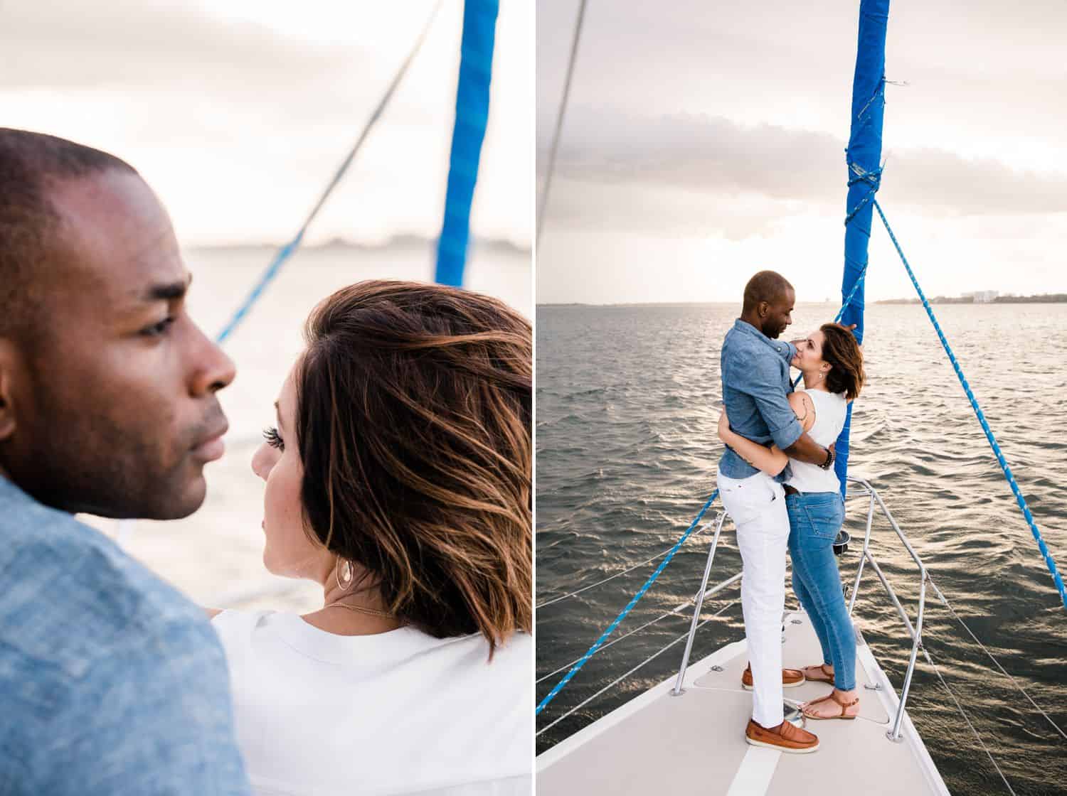 A Black man and a White woman sail together at sunset